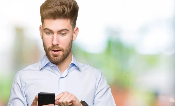 Young Handsome Man Business Using Smartphone Scared Shock Surprise Face — Stock Photo, Image