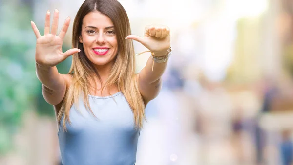 Young beautiful elegant business woman over isolated background showing and pointing up with fingers number six while smiling confident and happy.