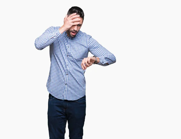 Joven Hombre Guapo Sobre Fondo Aislado Mirando Tiempo Reloj Preocupado —  Fotos de Stock