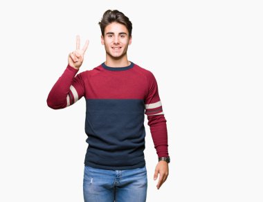 Yakışıklı delikanlı gösterilen ve parmakları ile işaret izole arka plan üzerinde ikincisi ise kendinden emin ve mutlu gülümseyerek.