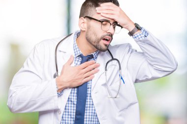 Yakışıklı genç doktor adam izole arka plan dokunmadan üzerinde hastalık ve ateş, grip ve soğuk, virüs hasta için alın