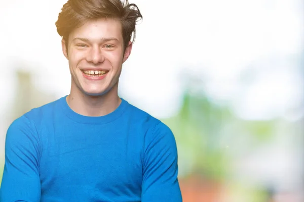 Ein Junger Gutaussehender Mann Mit Blauem Pullover Vor Einsamem Hintergrund — Stockfoto