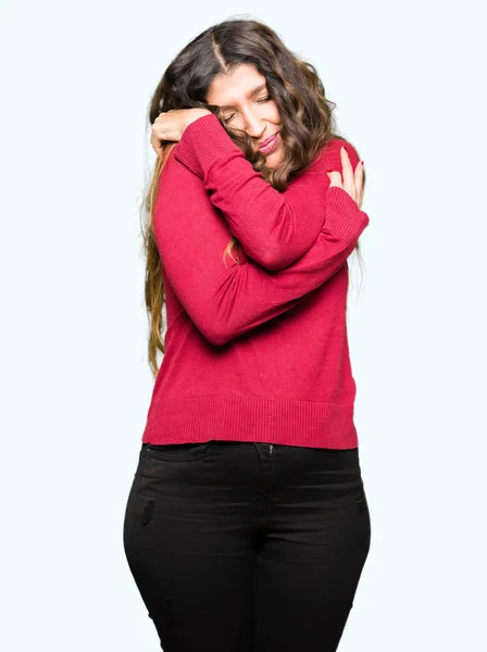 Young Beautiful Woman Wearing Red Sweater Hugging Oneself Happy Positive — Stock Photo, Image