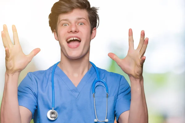 Young Doctor Wearing Medical Uniform Isolated Background Celebrating Crazy Amazed — Stock Photo, Image