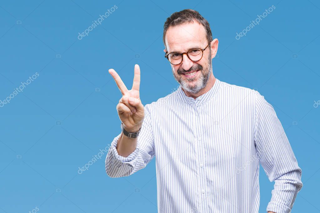 Middle age hoary senior man wearing glasses over isolated background smiling with happy face winking at the camera doing victory sign. Number two.