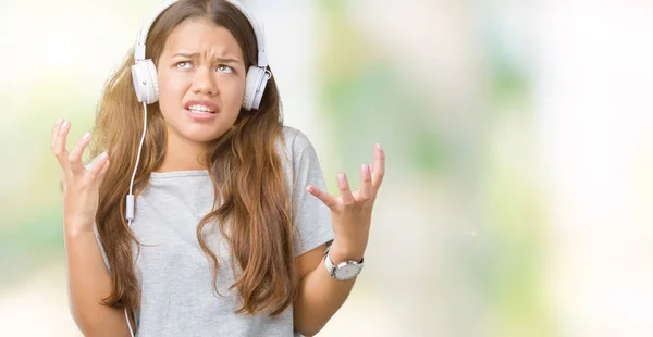 Junge Schöne Frau Mit Kopfhörer Musik Über Isolierten Hintergrund Verrückt — Stockfoto