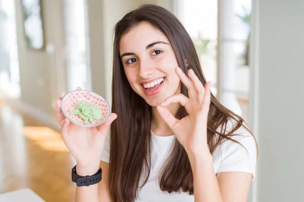 Beautiful Young Woman Holding Spicy Asian Wasabi Doing Sign Fingers — Stock Photo, Image