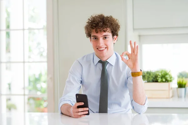 Young Business Man Using Smartphone Office Doing Sign Fingers Excellent — Stock Photo, Image