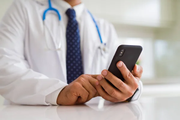 Close up middle age doctor man hands using smartphone — Stock Photo, Image