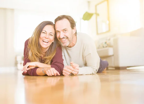 Beautiful romantic couple sitting together on the floor at home — Stock Photo, Image