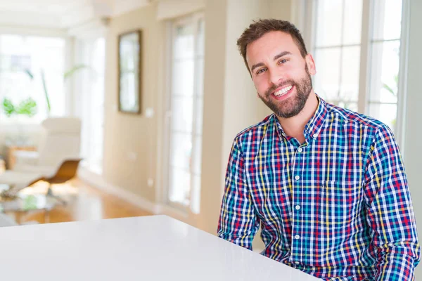 Handsome man wearing colorful shirt and smiling positive at the — Stock Photo, Image