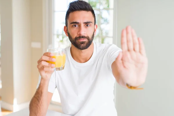 Handsome Hispanic Man Drinking Healthy Orange Juice Open Hand Doing — Stock Photo, Image