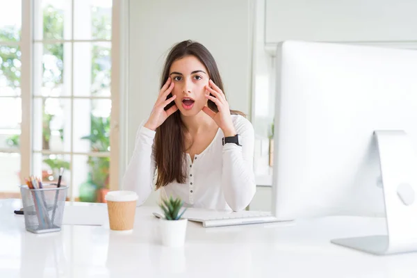 Beautiful Young Woman Working Using Computer Afraid Shocked Surprise Expression — Stock Photo, Image