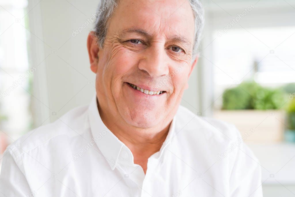 Handsome senior man smiling confident