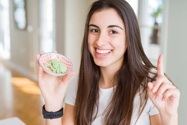 Beautiful Young Woman Holding Spicy Asian Wasabi Surprised Idea Question — Stock Photo, Image