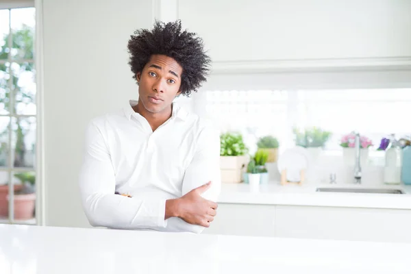 African American man skeptic and nervous, disapproving expression on face with crossed arms. Negative person.