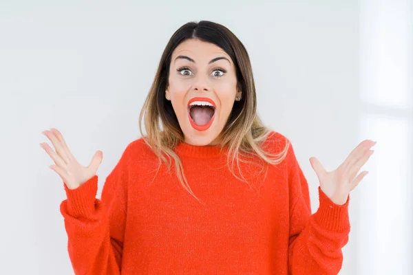 Young Woman Wearing Casual Red Sweater Isolated Background Celebrating Crazy — Stock Photo, Image