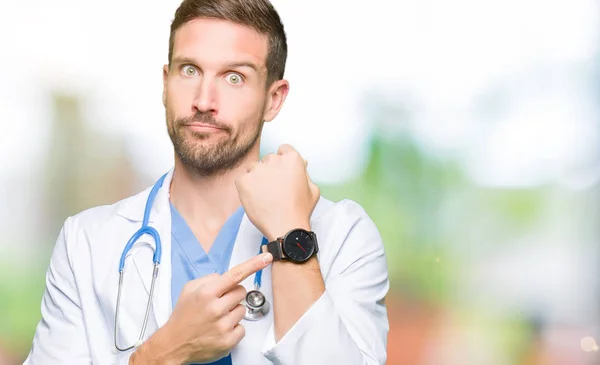 Handsome Doctor Man Wearing Medical Uniform Isolated Background Hurry Pointing — Stock Photo, Image