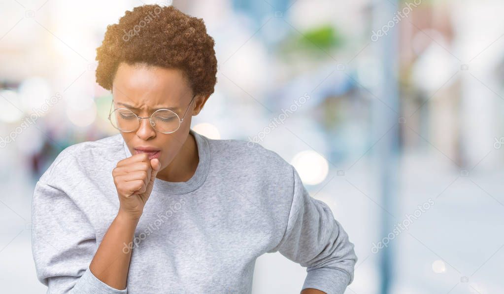 Young beautiful african american woman wearing glasses over isolated background feeling unwell and coughing as symptom for cold or bronchitis. Healthcare concept.