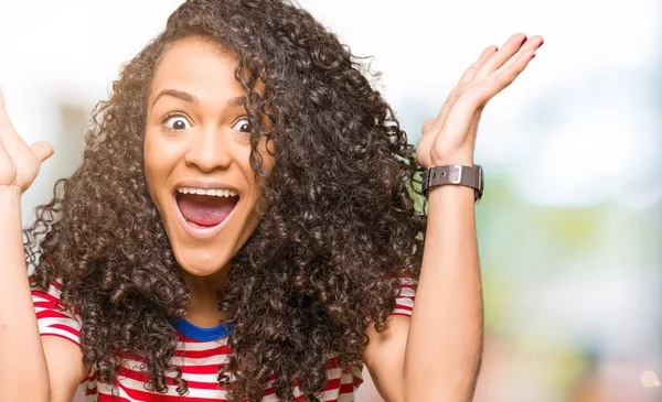 Young Beautiful Woman Curly Hair Wearing Stripes Shirt Celebrating Crazy — Stock Photo, Image