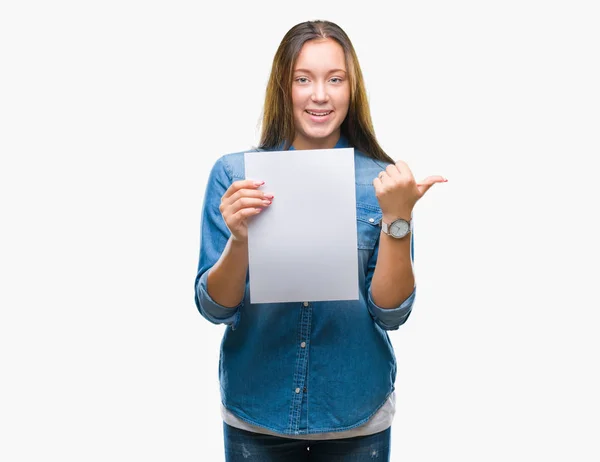 Young Caucasian Woman Holding Blank Paper Sheet Isolated Background Pointing — Stock Photo, Image