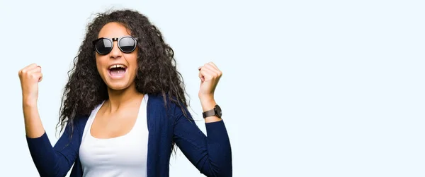 Young Beautiful Girl Curly Hair Wearing Fashion Sunglasses Celebrating Surprised — Stock Photo, Image