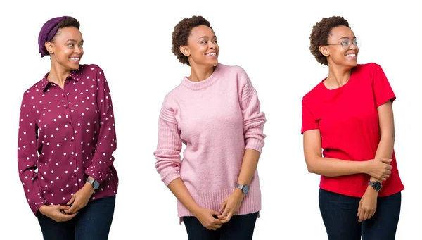 年轻的非洲裔美国女人与非洲头发在孤立的背景看着一边面带微笑 自然的表情 笑自信 — 图库照片