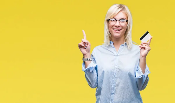 Young Beautiful Blonde Business Woman Holding Credit Card Isolated Background — Stock Photo, Image