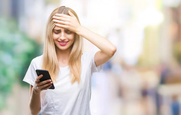 Young Beautiful Blonde Woman Using Smartphone Isolated Background Stressed Hand — Stock Photo, Image