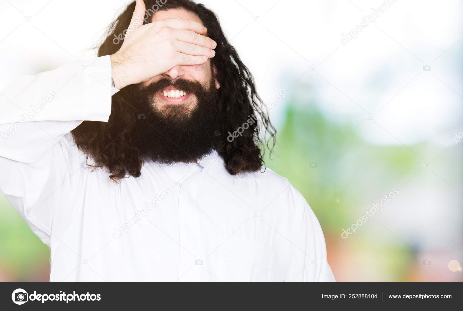 Photos Jesus Laughing Man Wearing Jesus Christ Costume Smiling Laughing Hand Face Covering Stock Photo C ron Amat