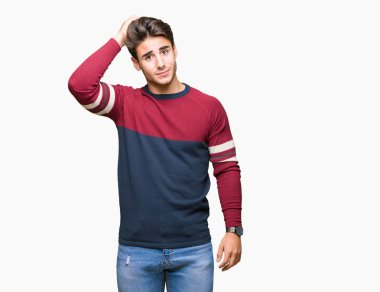 Yakışıklı delikanlı izole arka plan üzerinde yanıltır ve soru hakkında merak ediyorum. Şüphe, kafasına el ile düşünme ile belirsiz. Dalgın kavramı.