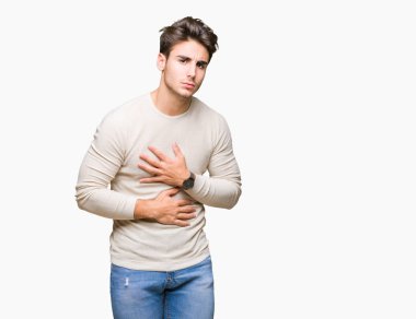 Genç yakışıklı adam izole mide üzerinde el ile arka plan çünkü hazımsızlık, ağrılı hastalık hasta hissediyor. Ağrısı kavramı.