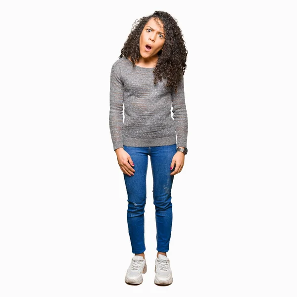 Young Beautiful Woman Curly Hair Wearing Grey Sweater Shock Face — Stock Photo, Image