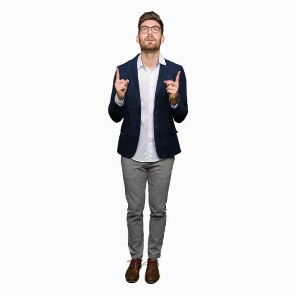 Young Handsome Business Man Wearing Glasses Amazed Surprised Looking Pointing — Stock Photo, Image