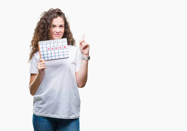 Jonge Brunette Meisje Bedrijf Menstruatie Kalender Geïsoleerde Achtergrond Verrast Met — Stockfoto