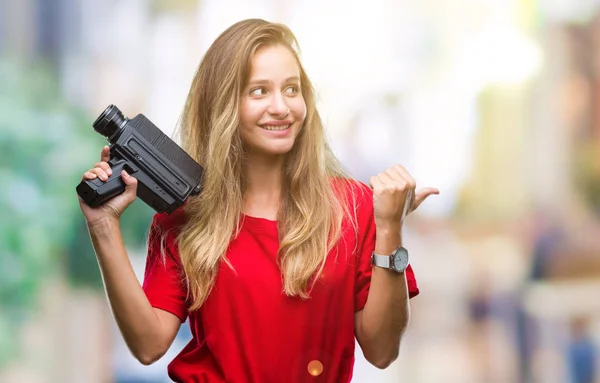 Young Beautiful Blonde Woman Filming Using Vintage Camera Isolated Background — Stock Photo, Image