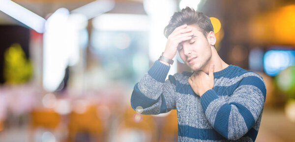 Young handsome man over isolated background Touching forehead for illness and fever, flu and cold, virus sick
