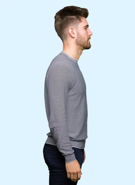 Young Handsome Man Wearing Stripes Sweater Looking Side Relax Profile — Stock Photo, Image