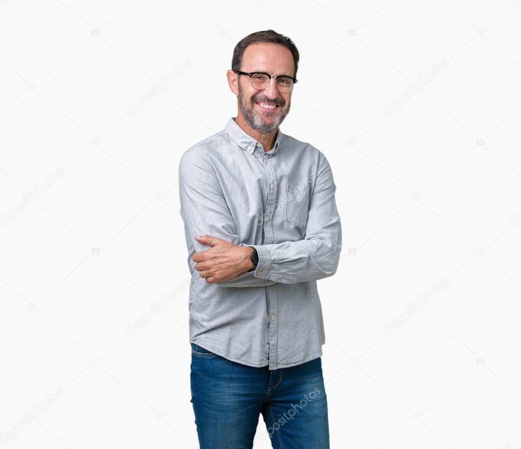 Handsome middle age elegant senior man wearing glasses over isolated background happy face smiling with crossed arms looking at the camera. Positive person.