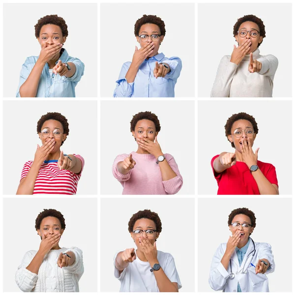 Young african american woman with afro hair over isolated background Laughing of you, pointing to the camera with finger hand over mouth, shame expression