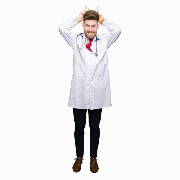 Young Handsome Doctor Man Wearing Medical Coat Posing Funny Crazy — Stock Photo, Image