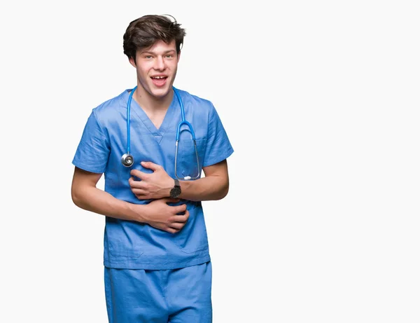 Młody Lekarz Noszenia Uniform Medyczny Białym Tle Tła Smiling Ciężko — Zdjęcie stockowe