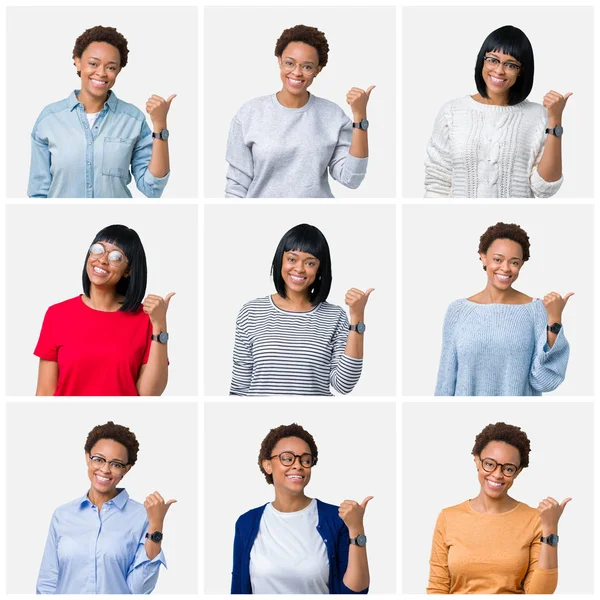 Seyir ve başparmak yanında yukarıyı mutlu yüz ile gülümseyen izole arka plan üzerinde afro saçlı genç Afro-Amerikan kadın.