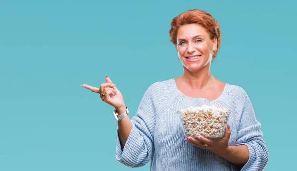 Atrractive Senior Caucasian Redhead Woman Eating Popcorn Isolated Background Very — Stock Photo, Image