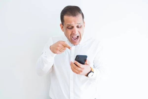 Hombre Mediana Edad Utilizando Teléfono Inteligente Sobre Pared Blanca Muy —  Fotos de Stock