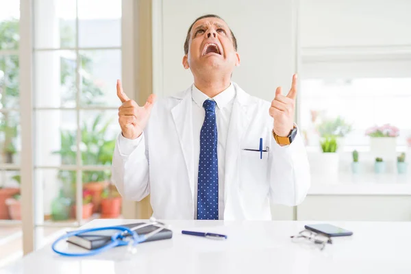 Middle Age Doctor Man Wearing Medical Coat Clinic Crazy Mad — Stock Photo, Image