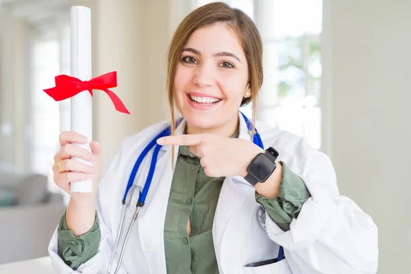 Beautiful Young Doctor Woman Holding Degree Very Happy Pointing Hand — Stock Photo, Image
