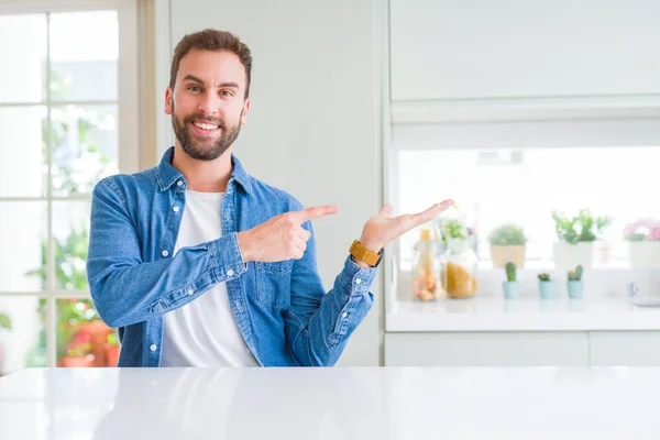Handsome Man Home Amazed Smiling Camera While Presenting Hand Pointing — Stock Photo, Image