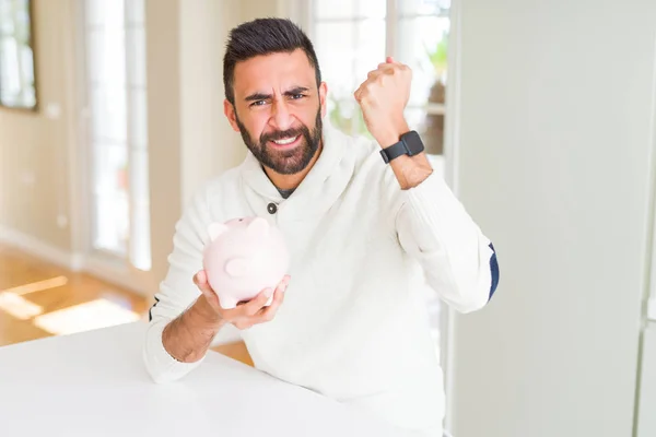 Handsome Hispanic Man Holding Piggy Bank Annoyed Frustrated Shouting Anger — Stock Photo, Image