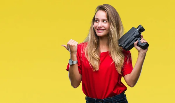 Young Beautiful Blonde Woman Filming Using Vintage Camera Isolated Background — Stock Photo, Image